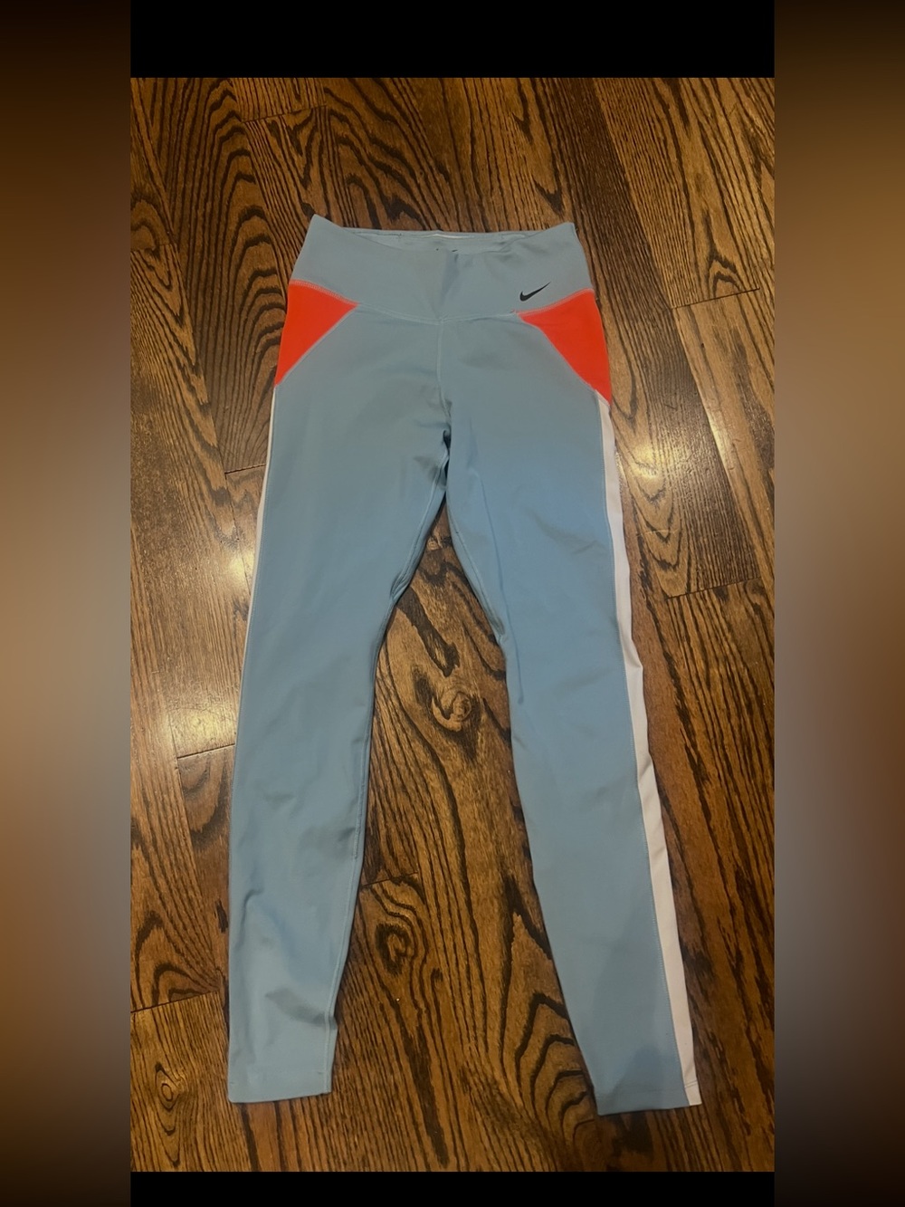 Nike womens Light Blue Athletic Leggings with Orange Accents-small